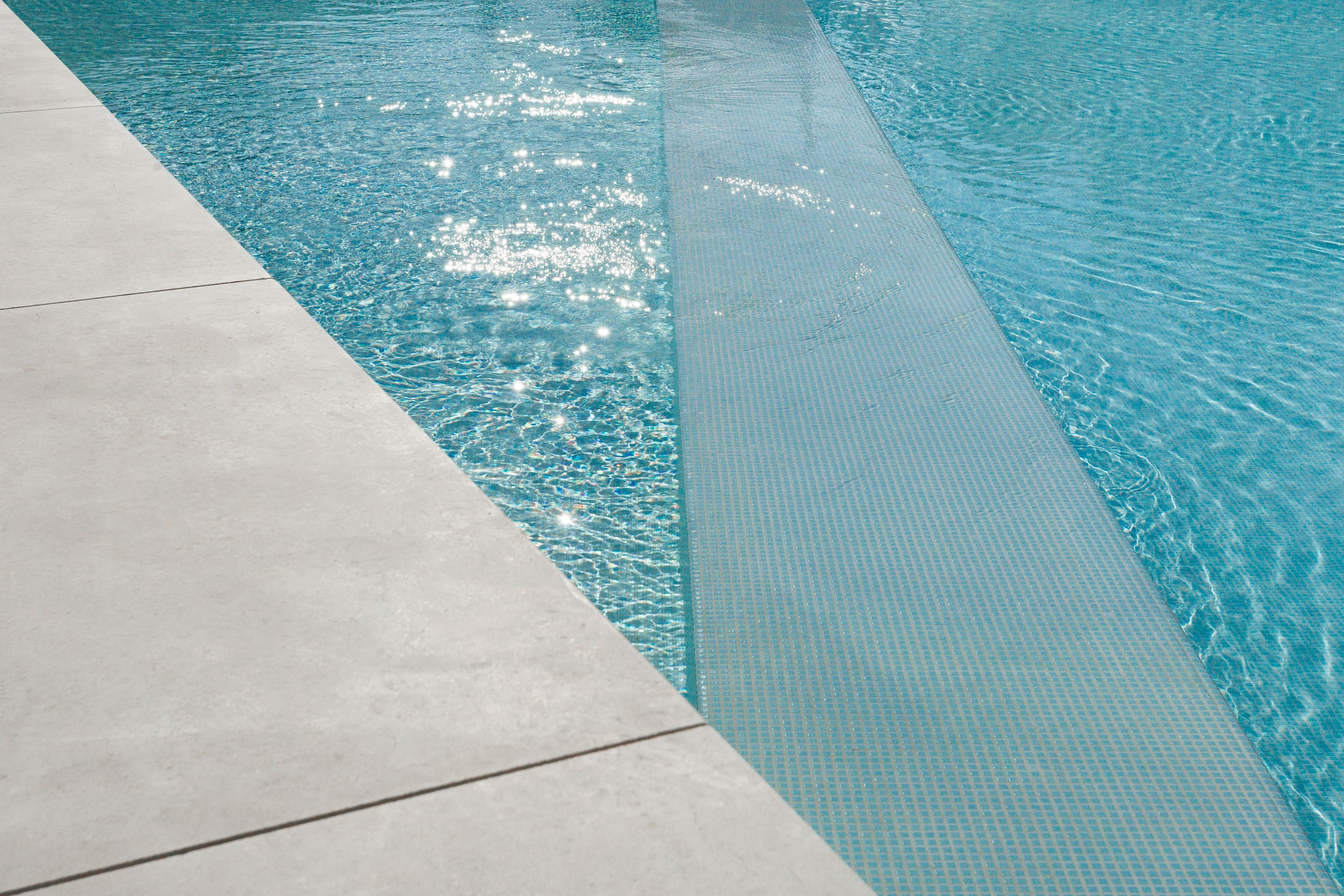 Resort-style pool deck with cabanas